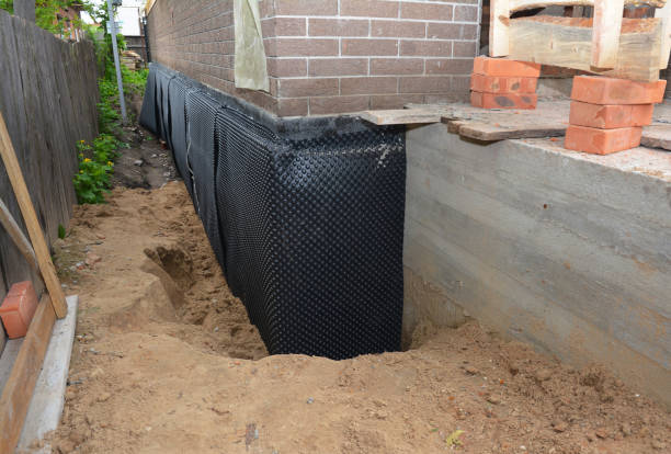 Happy homeowners after waterproofing job in Hobbs
